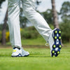 A man wearing the slime green Pulsar soft spikes. 