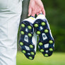 A man holding the slime green Pulsar soft spikes. 