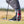 A bottom of a persons right golf shoe showing the red pulsar golf spikes attached.