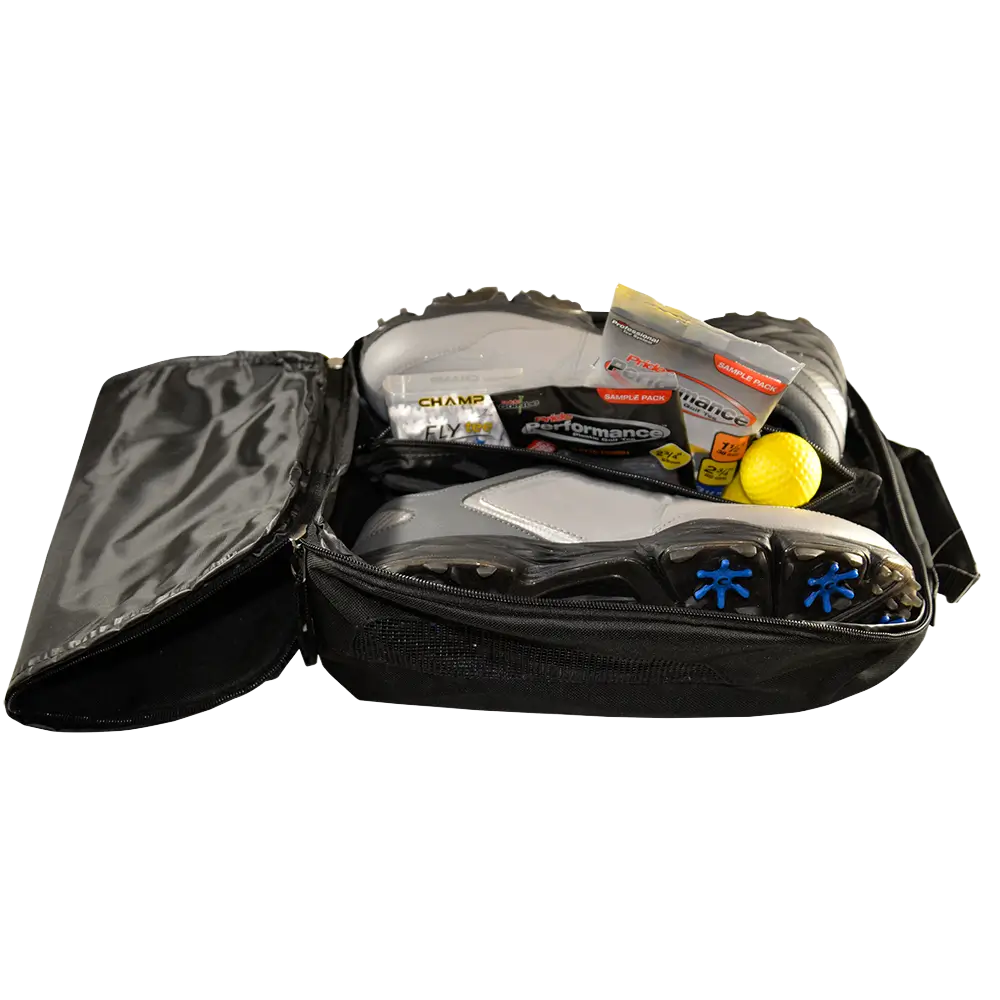 Black bag with athletic shoes, socks, and other items on a white background