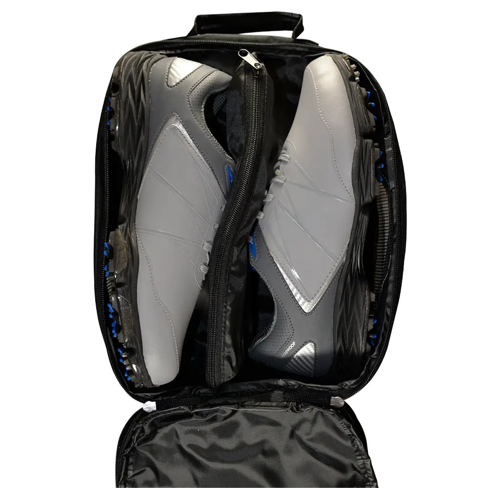 Black bag with a clear compartment containing a gray sneaker on a white background