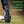 Silver Tornado Spikes attached to a golf shoe showing the benefits overview.